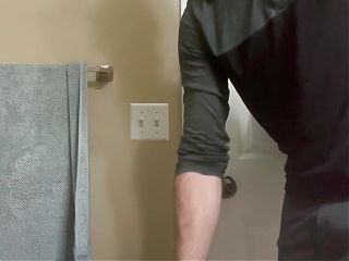 Sexy jock gets ready for a shower and pees